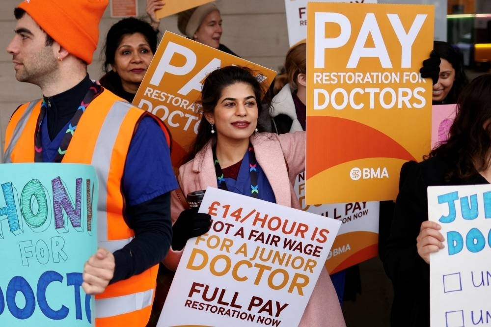 Junior Doctors protest during their strike, amid a dispute with the government over pay, outisde Chelsea and Westminster Hospital in London, March 13. REUTERS