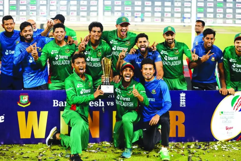 Bangladesh players celebrate with the trophy after winning the series. (Reuters)