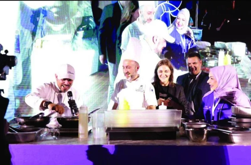 Georgian chef Georgi Alugishvili and Qatari chef Aisha al-Tamimi, along with Georgian ambassador Nikoloz Revazishvili, at a recent live cooking demonstration at QIFF 2023.