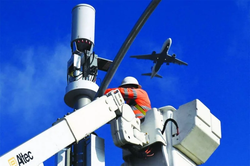 A contractor installs 5G equipment on a light pole near Los Angeles International Airport in California. Global aviation is facing significant challenges as time is fast running out for airlines to meet proposed regulatory deadlines in the United States to ensure they won’t suffer interference from 5G C-band transmissions from towers located near US airports and approach paths.