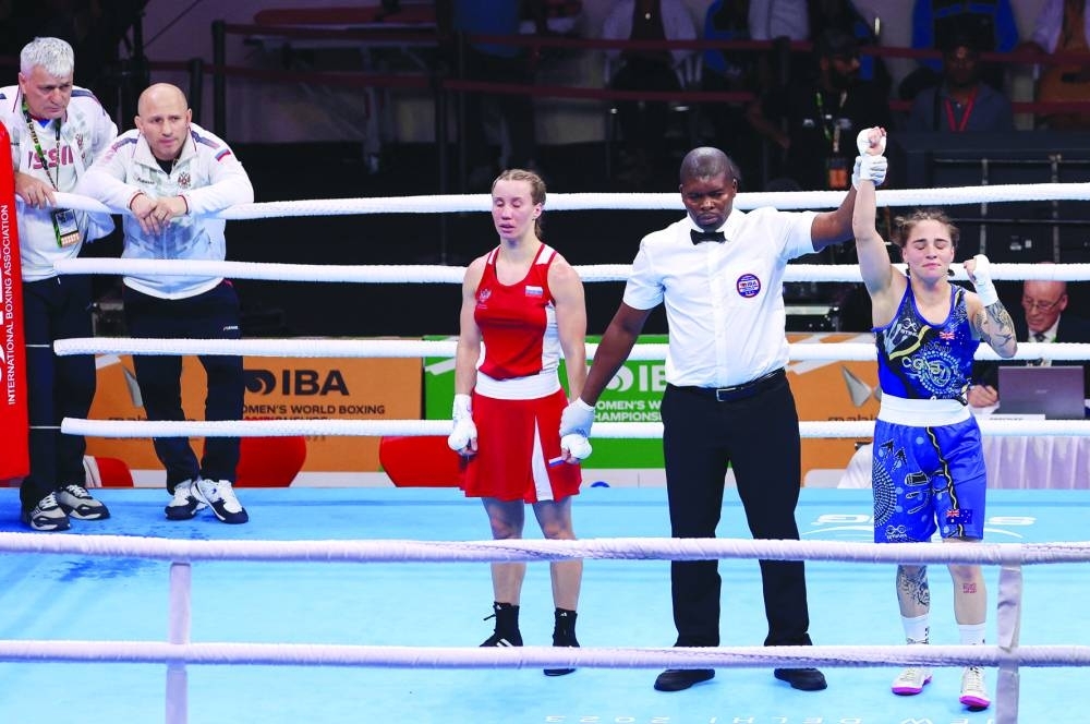 Russian boxer Anna Aedma (in red) reacts after her loss to Monique Suraci of Australia in the Round of 32 of the 50-52kg flyweight category at the Women’s World Boxing Championships in New Delhi yesterday. (Reuters)