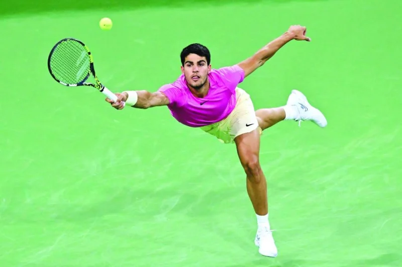Spain’s Carlos Alcaraz reaches for a forehand return during his quarter-final match against Canada’s Felix Auger-Aliassime at the Indian Wells Masters. (AFP)