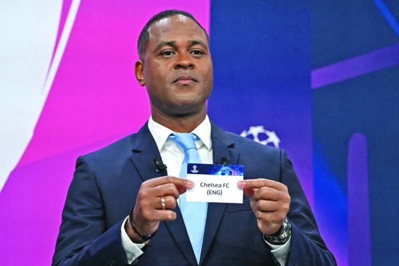 UEFA Champions League final ambassador Dutch former player Patrick Kluivert shows the paper slip of Chelsea FC during the draw for the quarter-final, semi-final and final of the 2022-2023 UEFA Champions League in Nyon yesterday. (AFP)