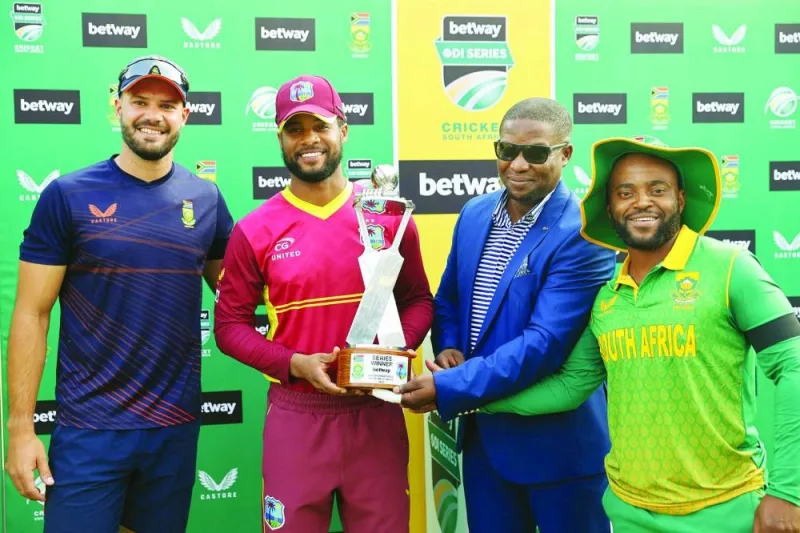 South Africa’s Aiden Markram (left), West Indies’ Shai Hope (second left), North West Cricket (NWC) president Tebogo Motlhabane (second right) and South Africa’s Temba Bavuma pose for a group photograph following the third one-day international (ODI) at JB Marks Oval in Potchefstroom on Tuesday. (AFP)