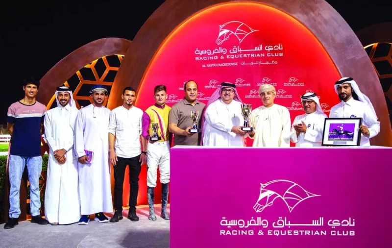 Connections of Ernest Aldrich pose with Al Jassasiya Cup yesterday. PICTURES: Juhaim