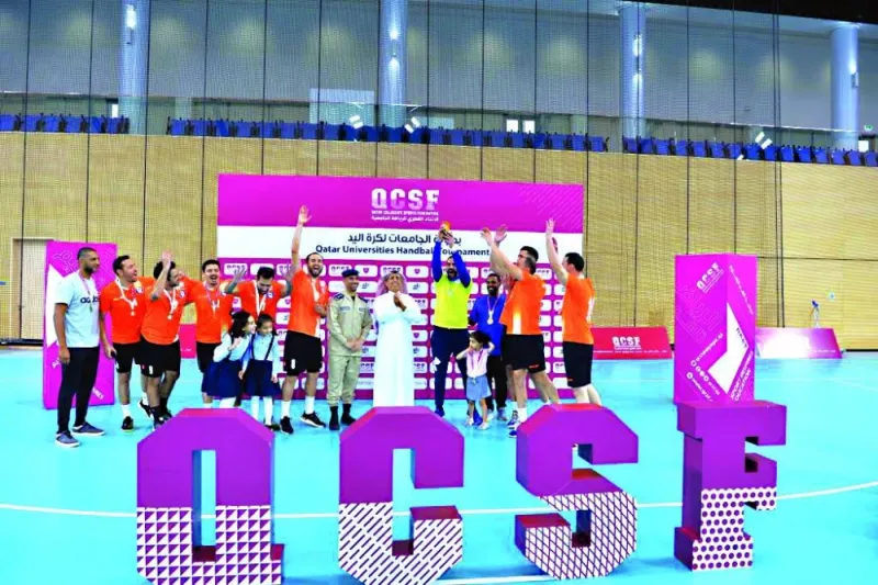 Players of Police Institute celebrate winning the gold medal in the Qatar Universities Handball League.