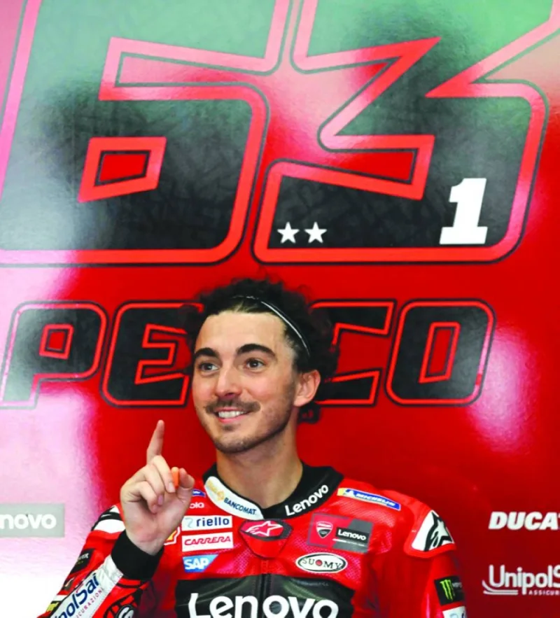 In this file photo taken on February 10, 2023, Ducati Lenovo’s Italian rider Francesco Bagnaia gestures inside his team garage during the first day of the pre-season MotoGP winter test at Sepang International Circuit in Sepang. (AFP)