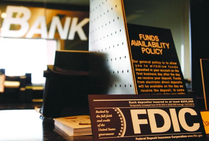 Signs explaining Federal Deposit Insurance Corporation (FDIC) and other banking policies are shown on the counter of a bank in Westminster, Colorado. (Reuters) 