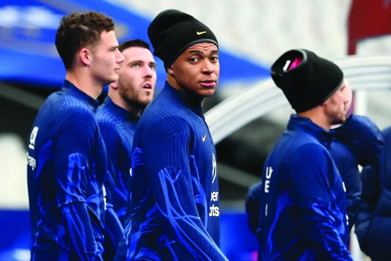 France’s forward Kylian Mbappe (centre) with teammates arrive for a training session at the Stade de France in Saint-Denis yesterday, on the eve of the UEFA Euro 2024 qualifier against Netherlands. (AFP)