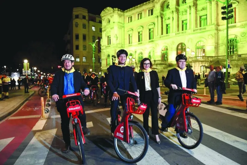 FROM LEFT: The head of Basque regional government’s culture department Bingen Zupiria, the General Director of the Tour de France Christian Prudhomme, the head of Basque regional government’s public administration Elixabete Etxanobe and the Bilbao’s mayor Juan Mari Aburto pose with bicycles in Bilbao upon the countdown of 100 days for the start of the 2023 Tour de France cycling race. (AFP)
