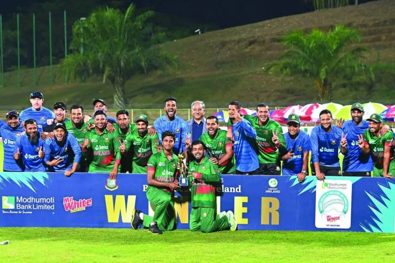 Bangladesh’s players pose with the trophy after winning the series at the end of the third and final one-day international (ODI) against Ireland at the Sylhet International Cricket Stadium. (AFP)