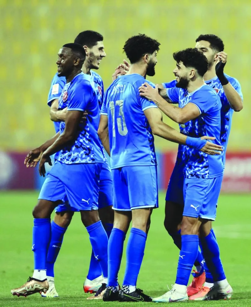 Al Duhail’s Ferjani Sassi (centre) celebrate with teammate after scoring a goal against Al Sadd in the Ooredoo Cup semi-final at the Suheim Bin Hamad Stadium on Thursday. Al Duhail won 3-1. 
