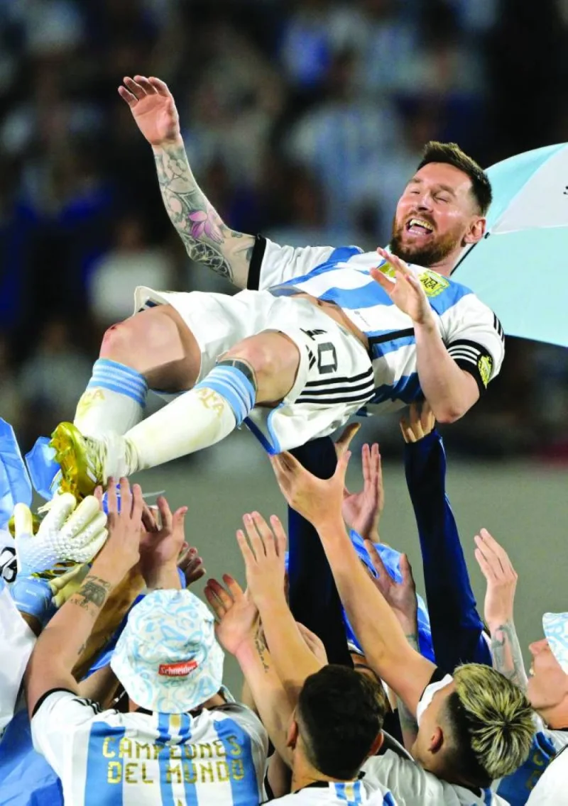 Argentina’s Lionel Messi is thrown up in the air by teammates during a recognition ceremony for the World Cup winning players at Monumental Stadium in Buenos Aires on Thursday. (Reuters)