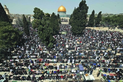 People perform the first Friday noon prayer of the fasting month of Ramadan, at the Al-Aqsa Mosque compound in Jerusalem, on Friday..