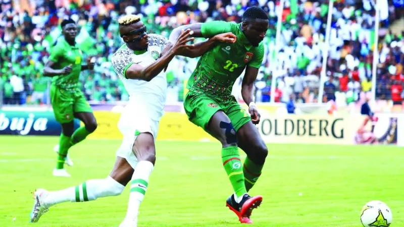 Nigeria’s Victor Osimhen (left) and Guinea-Bissau’s Opa Sangante vie for the ball during the Africa Cup of Nations qualifying match.