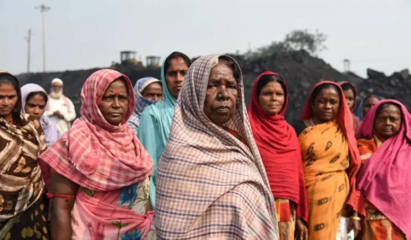 Women coal loaders pose for a picture in Jharia coalfield, India, November 10, 2022.
