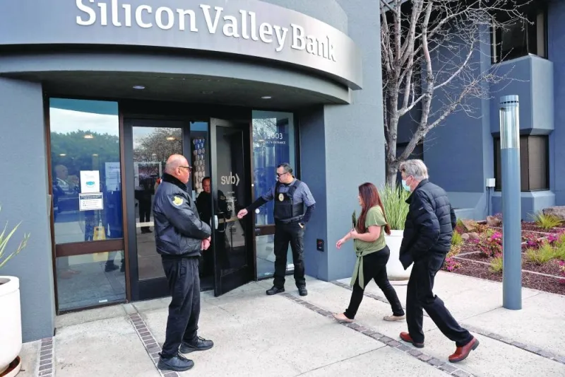 A customer is escorted into the Silicon Valley Bank headquarters in Santa Clara, California, early this month. (Reuters)