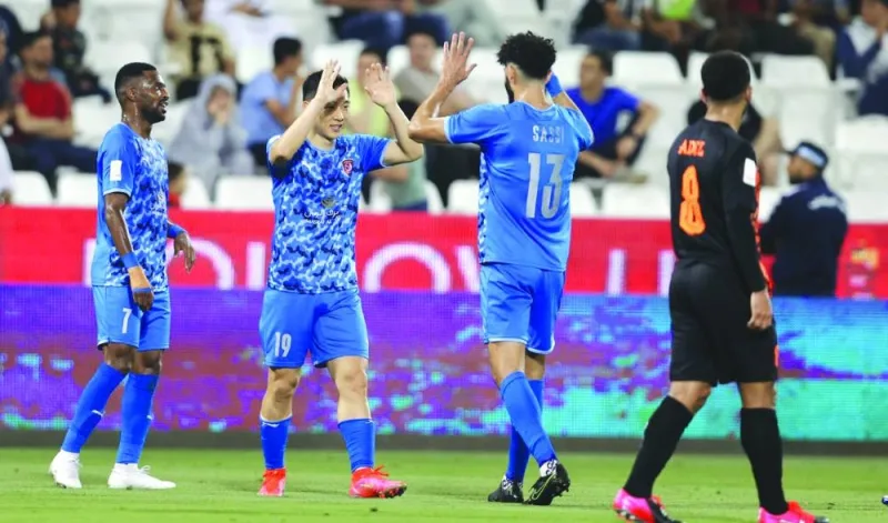 Al Duhail’s Nam Tae-hee (second left) celebrates with teammates after scoring against Umm Salal in the Ooredoo Cup final at the Jassim Bin Hamad Stadium on Tuesday.
