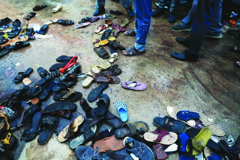 A pile of footwear is seen following a stampede during handout distribution in Karachi.