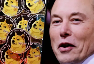 A photo of Elon Musk is displayed on a smartphone placed on representations of cryptocurrency dogecoin in this illustration taken June 16, 2022. REUTERS/Dado Ruvic/Illustration/File Photo
