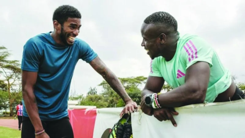 Sharry Dodin (left) soaks up the advice from Commonwealth 100m champion Ferdinand Omanyala in Nairobi. (AFP)