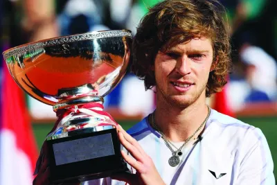 Russia’s Andrey Rublev celebrates with his trophy after winning the Monte-Carlo ATP Masters Series final against Denmark’s Holger Rune yesterday. (AFP)
