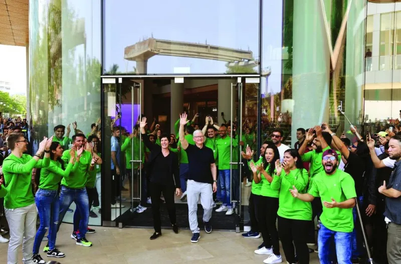 Apple CEO Tim Cook and Deirdre O’Brien, Apple’s senior vice-president of Retail and People greet people at the inauguration of India’s first Apple retail store in Mumbai, India, yesterday.