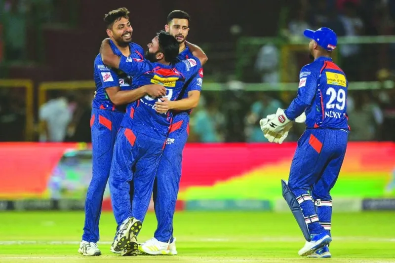 Lucknow Super Giants’ Avesh Khan (left) celebrates with teammates after taking the wicket of Rajasthan Royals’ Devdutt Padikkal 
(not pictured) during the IPL match in Jaipur yesterday. (AFP)
