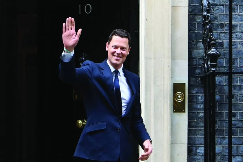 Britain’s new Justice Secretary Alex Chalk leaves Number 10 Downing Street in London, on Friday.