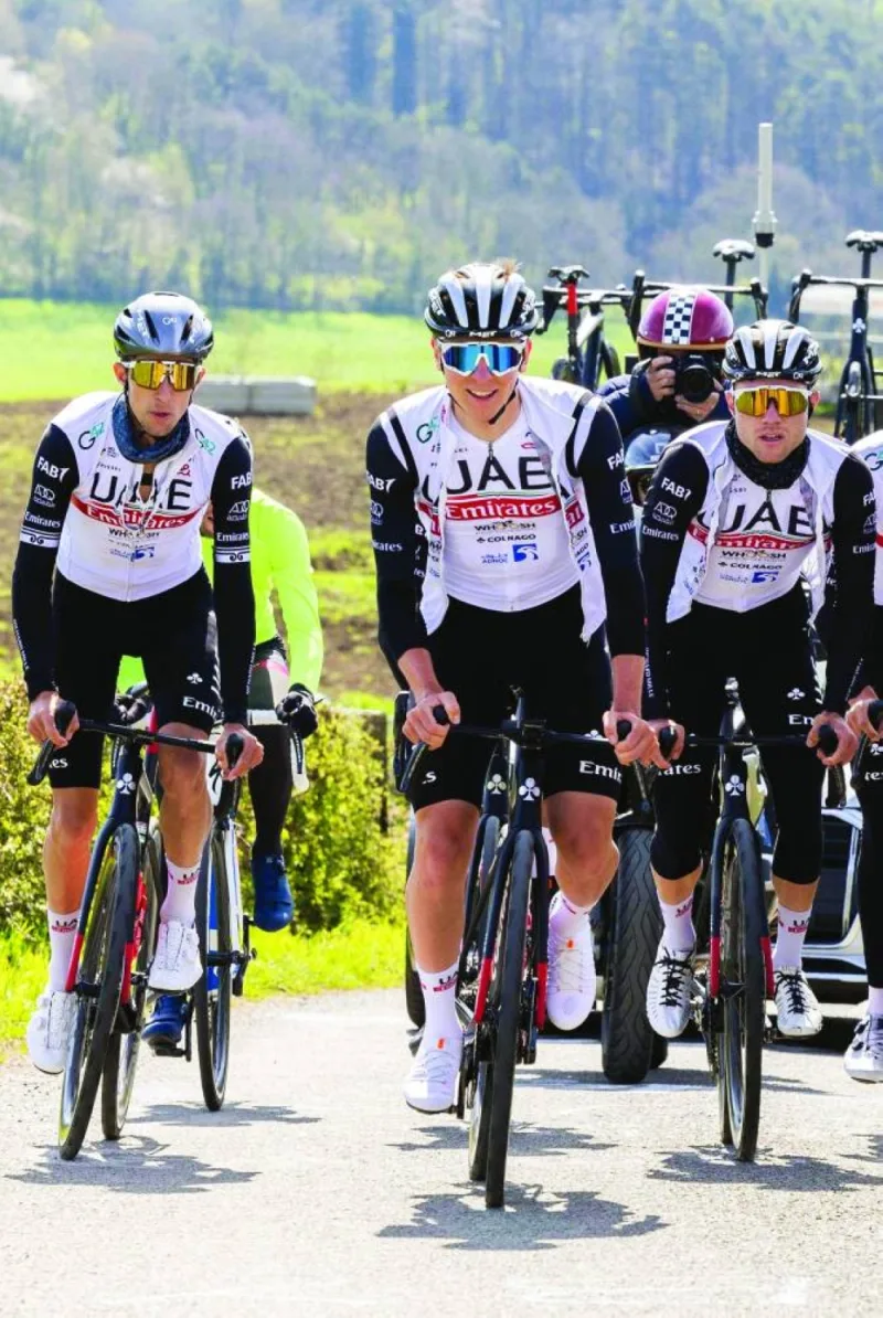 Tadej Pogacar (centre) of UAE Team Emirates rides with teammates during a training and track reconnaissance session, ahead of the Liege-Bastogne-Liege one day cycling race, in Remouchamps, Aywaille, Belgium. (AFP)