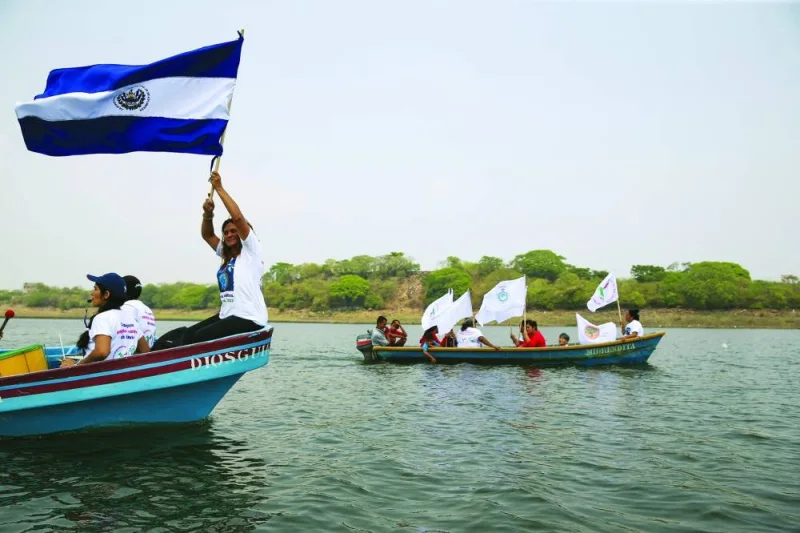 Protesters sail in fishing boats on Lake Guija during a demonstration against mining this week, ahead of Earth Day, in San Antonio Pajonal, El Salvador. (Reuters)