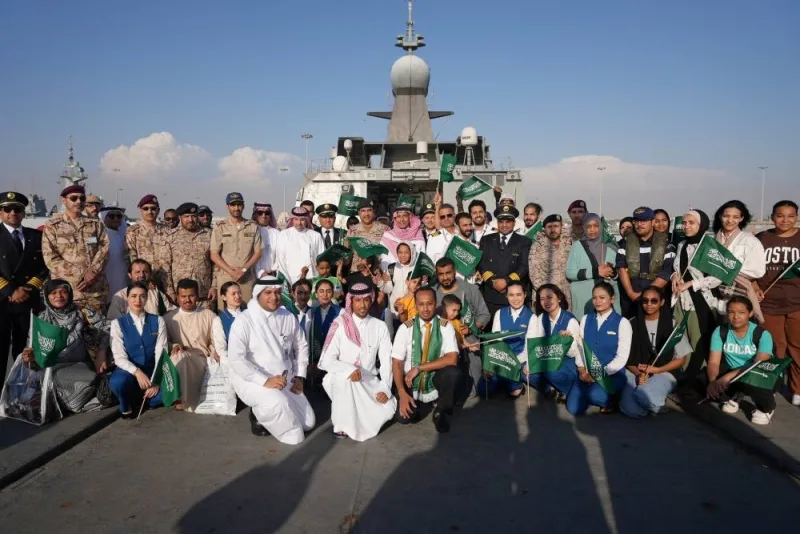Saudi citizens and staff of Saudi Airline pose for a group photo as they arrive at Jeddah Sea Port after being evacuated through Saudi Navy Ship from Sudan to escape the conflicts, Jeddah, Saudi Arabia, April 23. Saudi Ministry of Defense/Handout via REUTERS