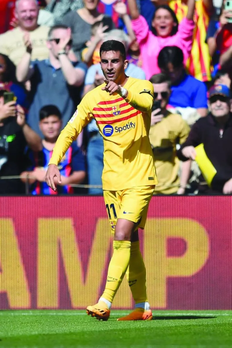 Barcelona&#039;s Ferran Torres celebrates scoring his team&#039;s first goal during the La LIga match against Atletico Madrid in Barcelona on Sunday. (AFP)