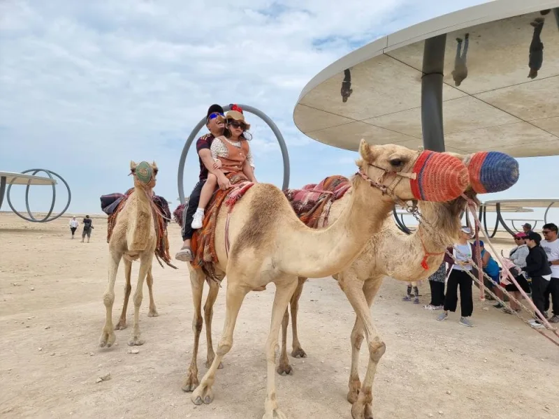 Camel rides offer a unique experience for visitors at &#039;Shadows Travelling on the Sea of the Day&#039; during the Eid holiday. PICTURE: Joey Aguilar