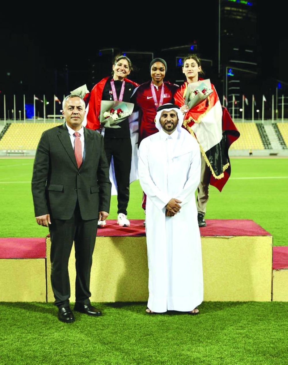 Gold-medallist Bashayer Obaid of Qatar celebrates on the podium of women’s triple jump of the West Asia Athletics Championship at Suheim Bin Hamad Stadium in Doha on Wednesday.
