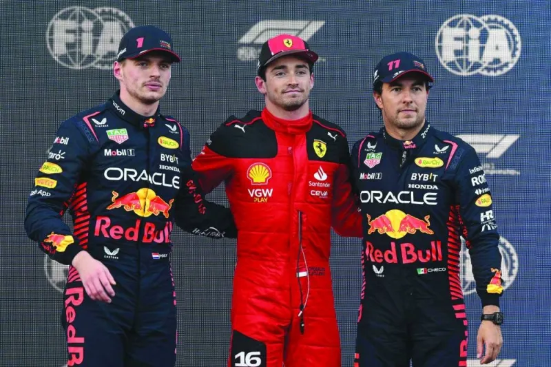 Pole position winner Ferrari’s driver Charles Leclerc (centre) poses with second-placed Red Bull Racing’s driver Max Verstappen (left) and third-placed Sergio Perez after the qualifying session for the Formula One Azerbaijan Grand Prix in Baku on Friday. (AFP)