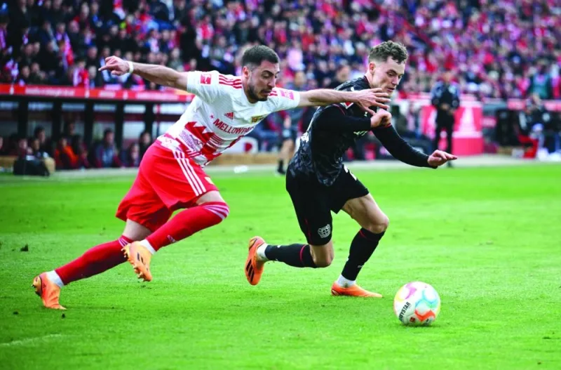 Soccer Football - Bundesliga - 1. FC Union Berlin v Bayer Leverkusen - Stadion An der Alten Forsterei, Berlin, Germany - April 29, 2023 
Bayer Leverkusen's Florian Wirtz in action with 1. FC Union Berlin's Josip Juranovic REUTERS/Annegret Hilse DFL REGULATIONS PROHIBIT ANY USE OF PHOTOGRAPHS AS IMAGE SEQUENCES AND/OR QUASI-VIDEO.