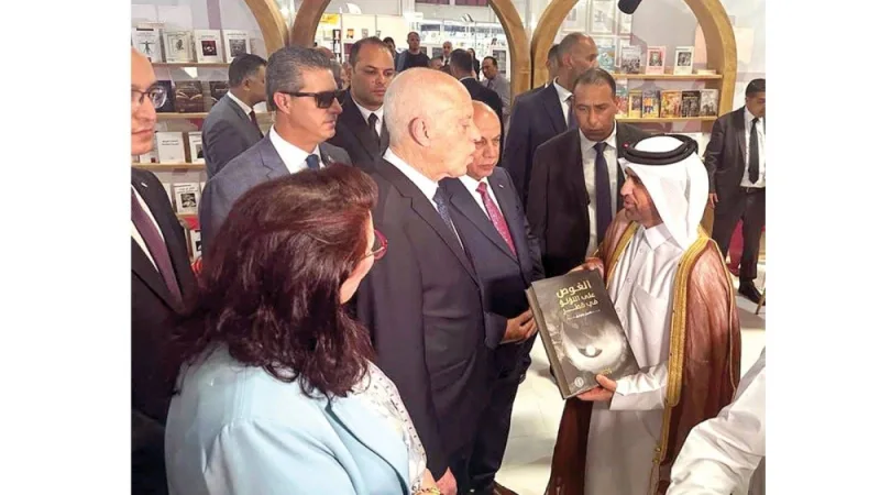 HE Prof Dr Khalid bin Ibrahim al-Sulaiti presenting the book to President Kais Saied.
