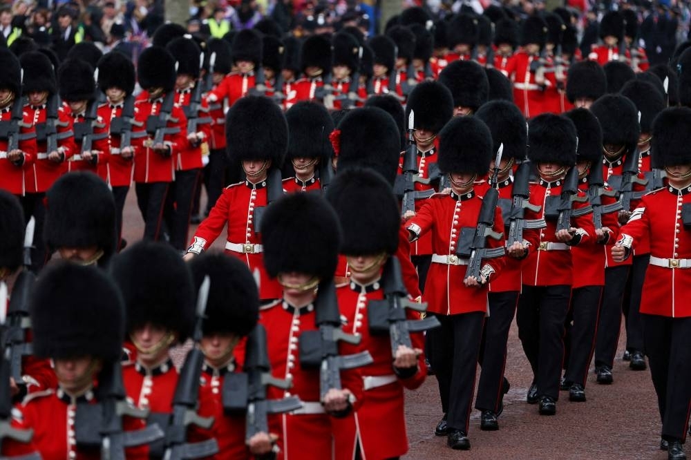 Troops march along the Mall in central London on May 6, 2023, following the coronations of Britain&#039;s King Charles III and Britain&#039;s Queen Camilla. REUTERS