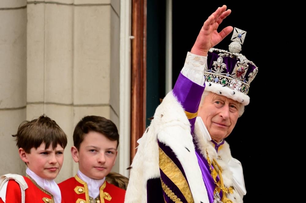King Charles III seen on the balcony of Buckingham Palace during the Coronation. REUTERS