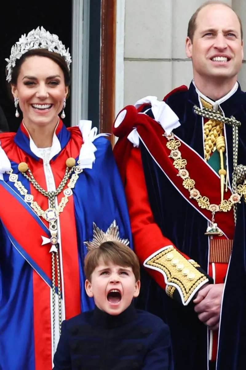 Britain&#039;s Prince William, Catherine, Princess of Wales, and Prince Louis stand on the Buckingham Palace balcony . REUTERS