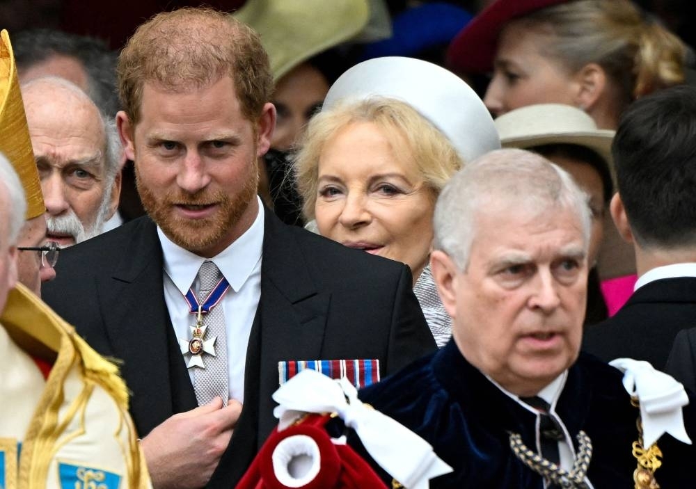 Britain&#039;s Prince Harry, Duke of Sussex (L) and Britain&#039;s Prince Andrew, Duke of York (R) leave after attending the coronations of Britain&#039;s King Charles III and Britain&#039;s Camilla, Queen Consort, at Westminster Abbey in central London. AFP
