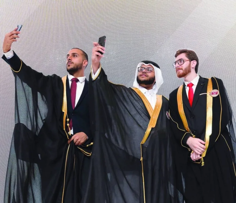 Graduates share a light moment