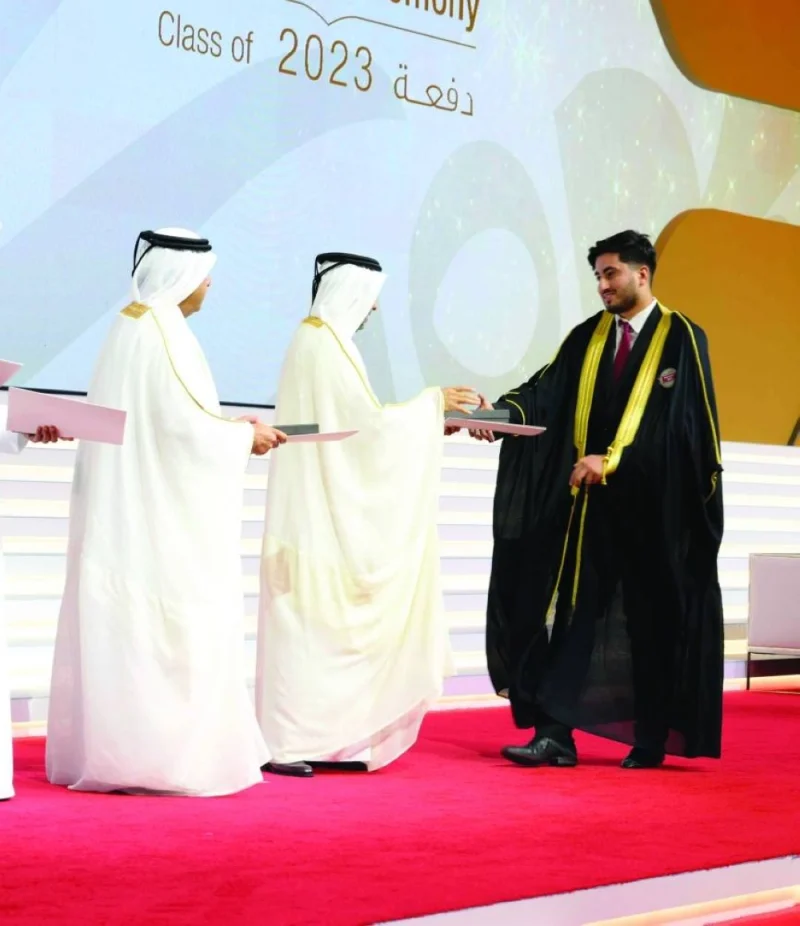 A graduate being honoured by the QU President.