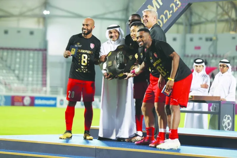 Qatar Stars League CEO Hani Taleb Ballan presents the Falcon Shield to QNB Stars League champions Al Duhail at the Abdullah bin Khalifa Stadium.
