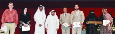 HE Sheikh Faisal bin Qassim al-Thani with a group of teachers honoured at the event. PICTURE: Shaji Kayamkulam.