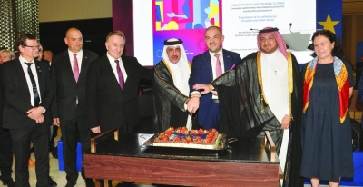 The EU ambassador to Qatar Dr Cristian Tudor is joined by Qatar&#039;s Minister of Transport HE Jassim Seif Ahmed al-Sulaiti, Ministry of Foreign Affairs&#039; Protocol Department director Ibrahim Fakhro in cutting a ceremonial cake at the Europe Day celebrations as other dignitaries look on. PICTURE: Shaji Kayamkulam.
