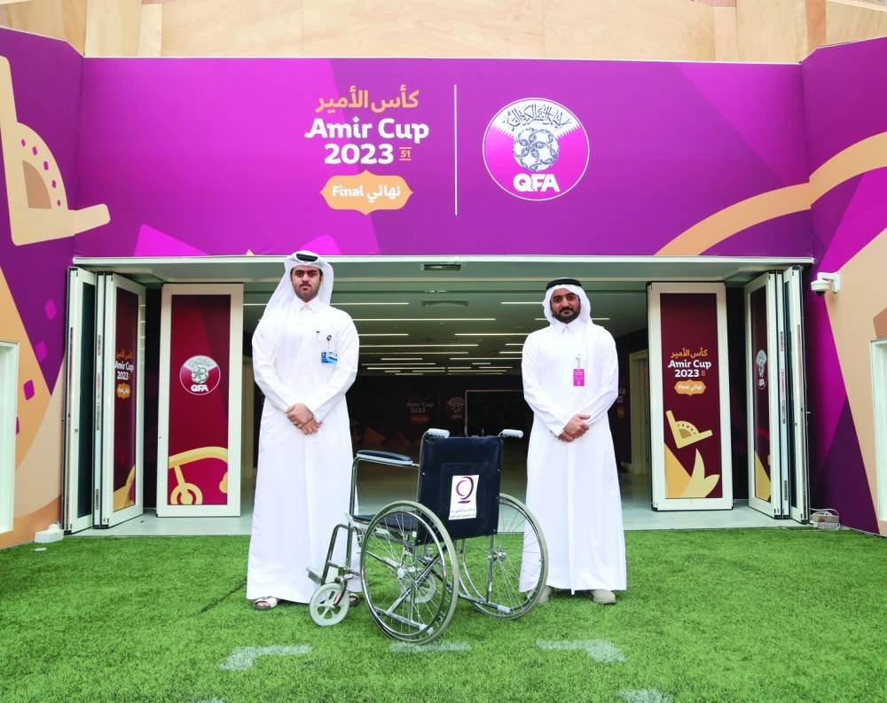 Officials mark the co-operation between Qatar Charity and the Qatar Football Association.