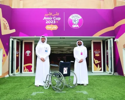 Officials mark the co-operation between Qatar Charity and the Qatar Football Association.