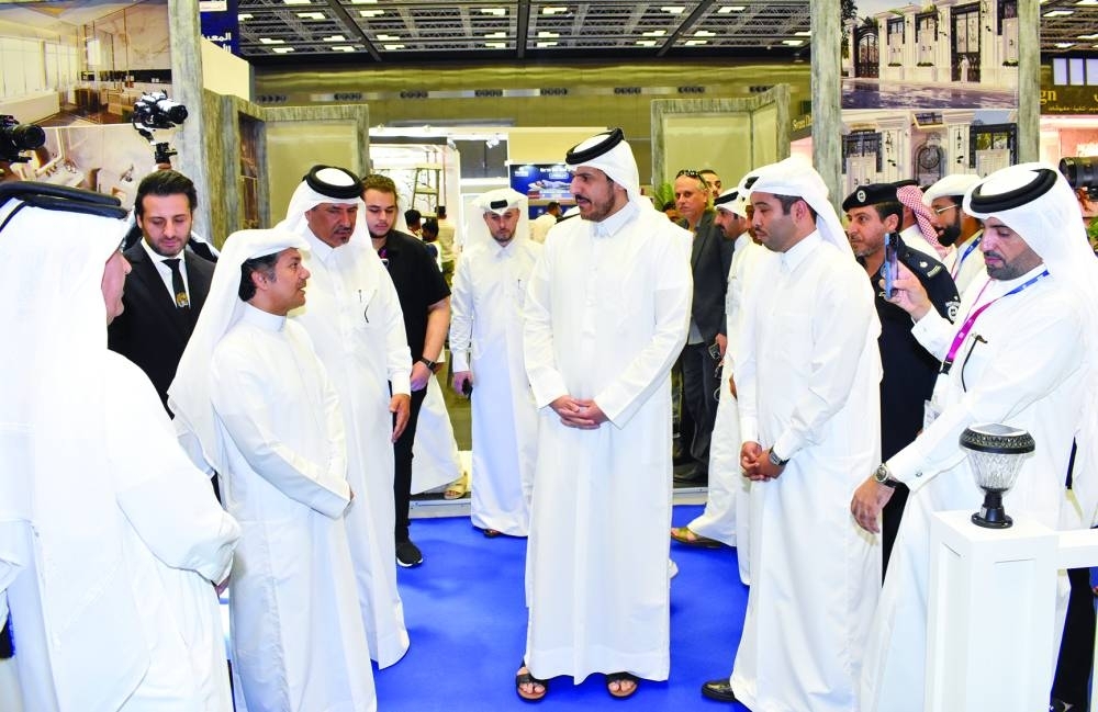 HE the Minister of Commerce and Industry Sheikh Mohammed bin Hamad bin Qassim al-Abdullah al-Thani during a tour of the exhibition hall with dignitaries from the public and private sector. PICTURE: Thajudheen.